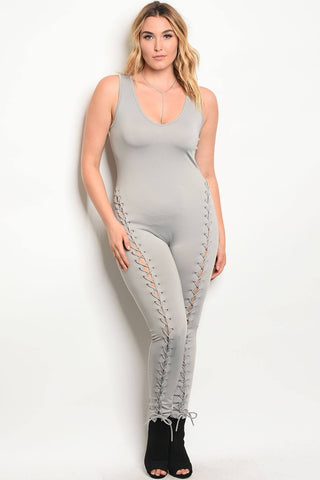 Plus size spandex blend jumpsuit with lace up details along the leg and a v neckline
