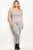 Plus size spandex blend jumpsuit with lace up details along the leg and a v neckline