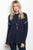 Ladies fashion long sleeve cream chunky knit sweater top that features a open back and rounded neckline
