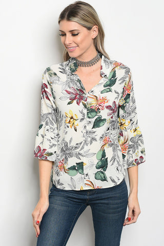 Ladies fashion 3/4 sleeve floral print blouse that features a v neckline