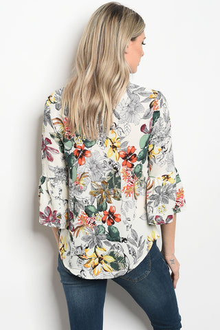 Ladies fashion 3/4 sleeve floral print blouse that features a v neckline
