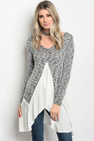 Ladies fashion long sleeve knit top that features a v neckline