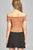 Ladies fashion short sleeve off the shoulder front keyhole w/self bow tie merrow hem knit top