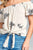 Ladies fashion flounce off the shoulder front self tie all over embo crinkle gauze woven top