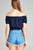 Ladies fashion plus size short sleeve off the shoulder bubble hem w/ribbon tie waist elastic crop challis woven top