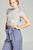 Ladies fashion short sleeve mock neck ruffle hem rayon spandex rib top
