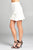 Ladies fashion banded waist wrap look w/ruffle mini skirt