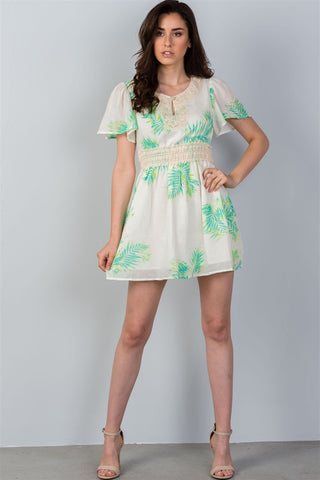 Ladies fashion crochet trim detail neckline button leaf print back cut-out mini dress - merchandiserus2