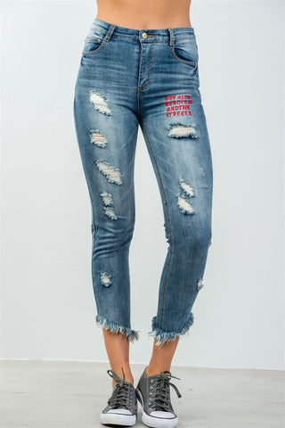 Ladies fashion denim distressed & graphic frayed hem skinny jeans