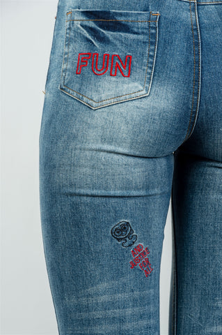 Ladies fashion denim distressed & graphic frayed hem skinny jeans