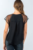 Ladies fashion semi-sheer black lace and ladder-stitch trim top