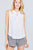 Sleeveless Ruffle Neck W/self Tie Smocked Yoke Detail Front Button Woven Top
