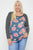 Floral Top Featuring Raglan Style Striped Sleeves And A Round Neck